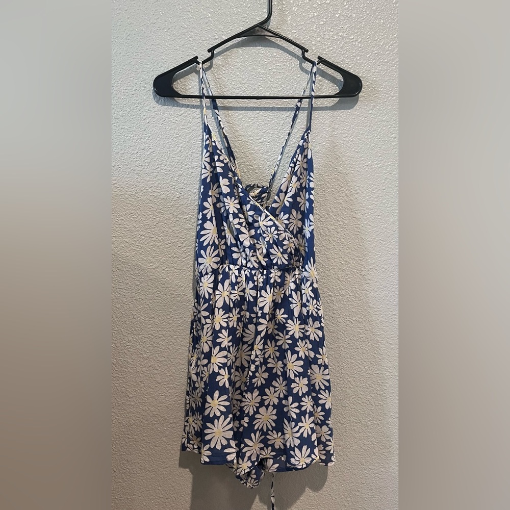 Blue romper with white flowers